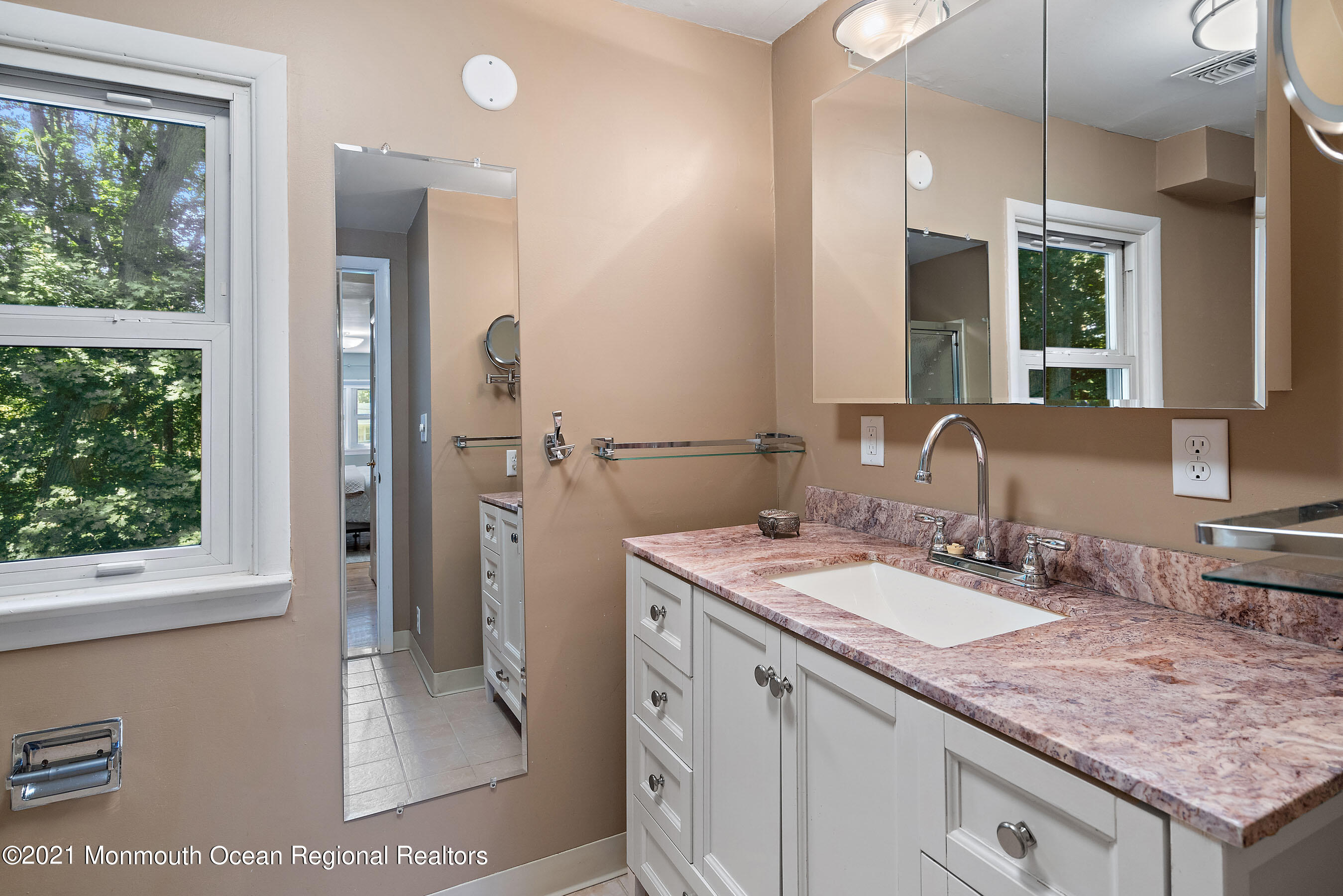 88 Beechwood Road Lincroft, NJ 07738 - Photo 21 of 33 a bathroom with a granite countertop sink and a mirror