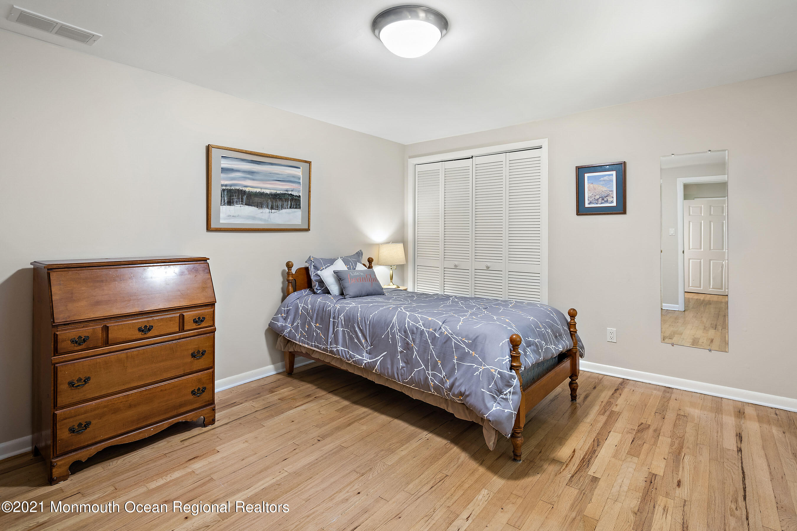 88 Beechwood Road Lincroft, NJ 07738 - Photo 22 of 33 a bedroom with a bed and a dresser