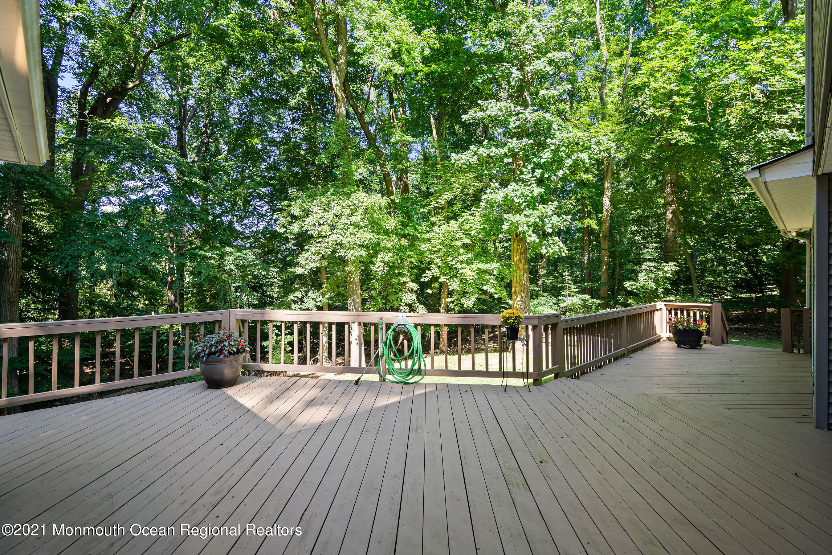 88 Beechwood Road Lincroft, NJ 07738 - Photo 24 of 33 a view of balcony with wooden floor and fence