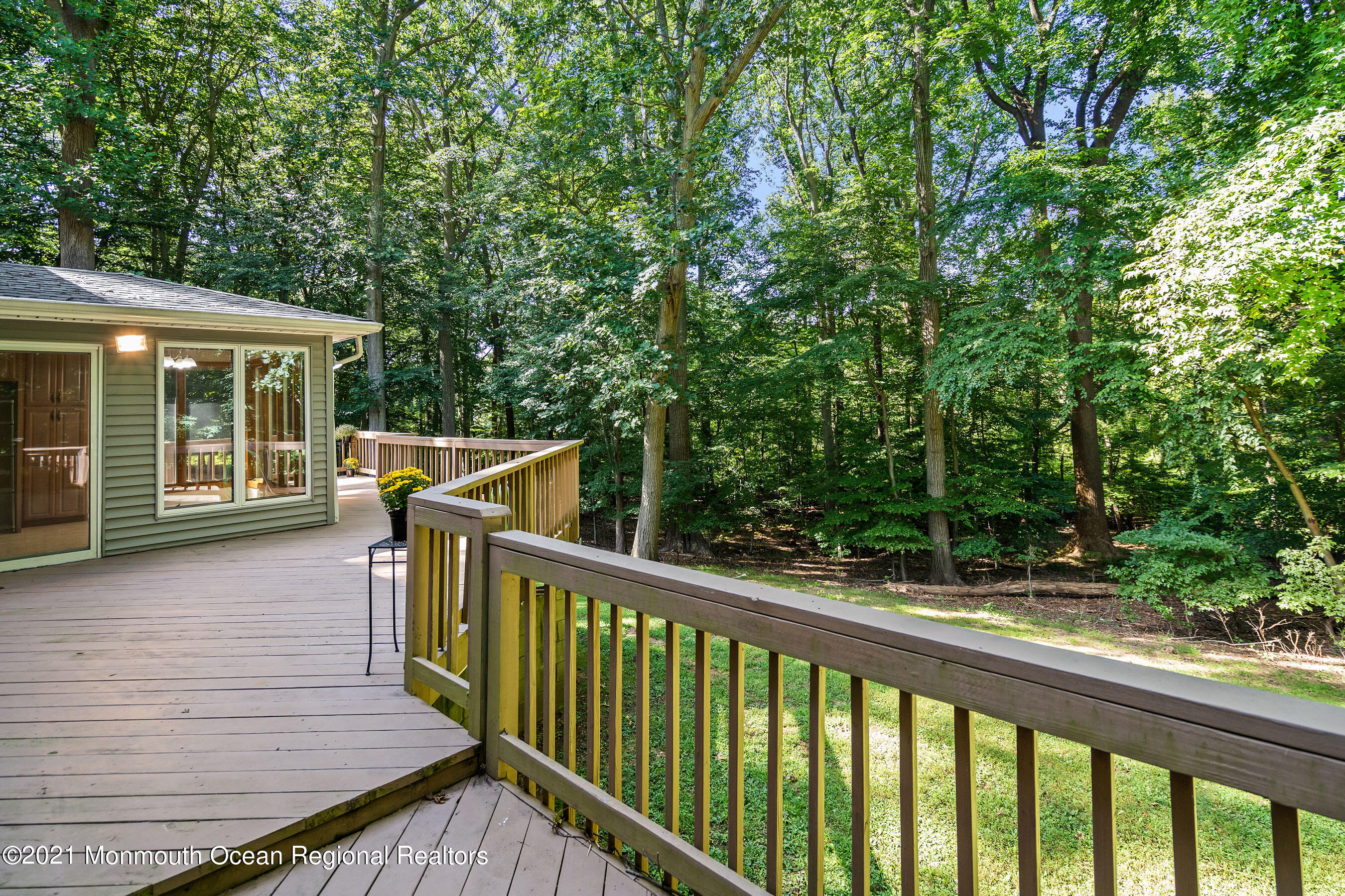 88 Beechwood Road Lincroft, NJ 07738 - Photo 25 of 33 a view of a wooden deck and a yard with wooden fence