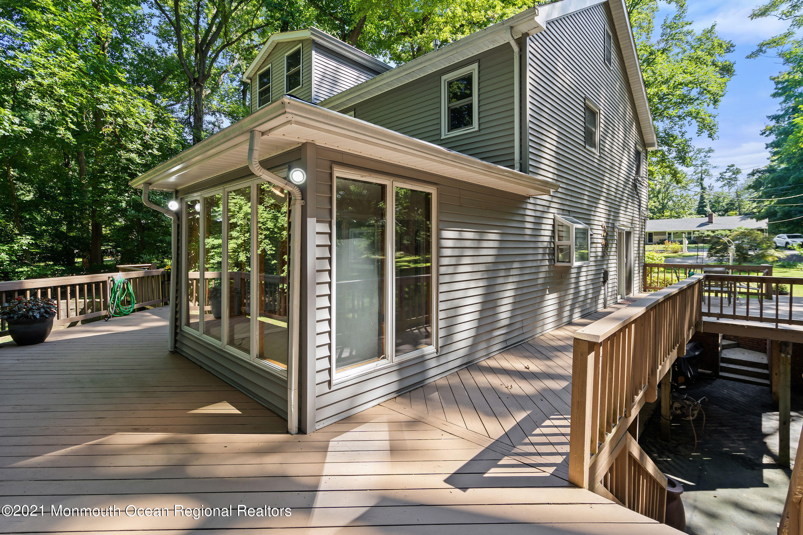 88 Beechwood Road Lincroft, NJ 07738 - Photo 26 of 33 a view of a house with backyard and deck