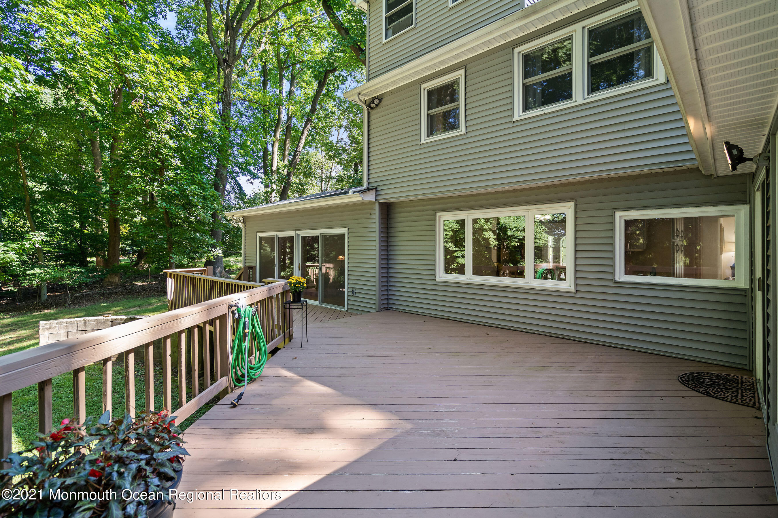 88 Beechwood Road Lincroft, NJ 07738 - Photo 28 of 33 a view of a house with backyard and wooden deck