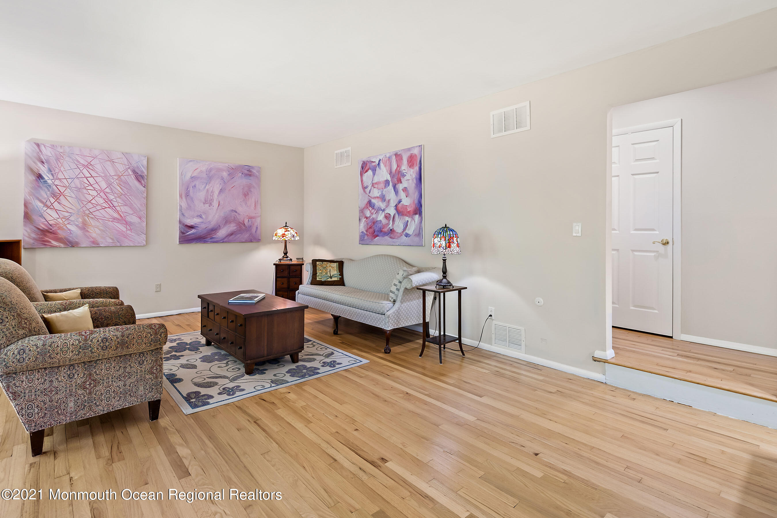 88 Beechwood Road Lincroft, NJ 07738 - Photo 7 of 33 a living room with furniture and a wooden floor