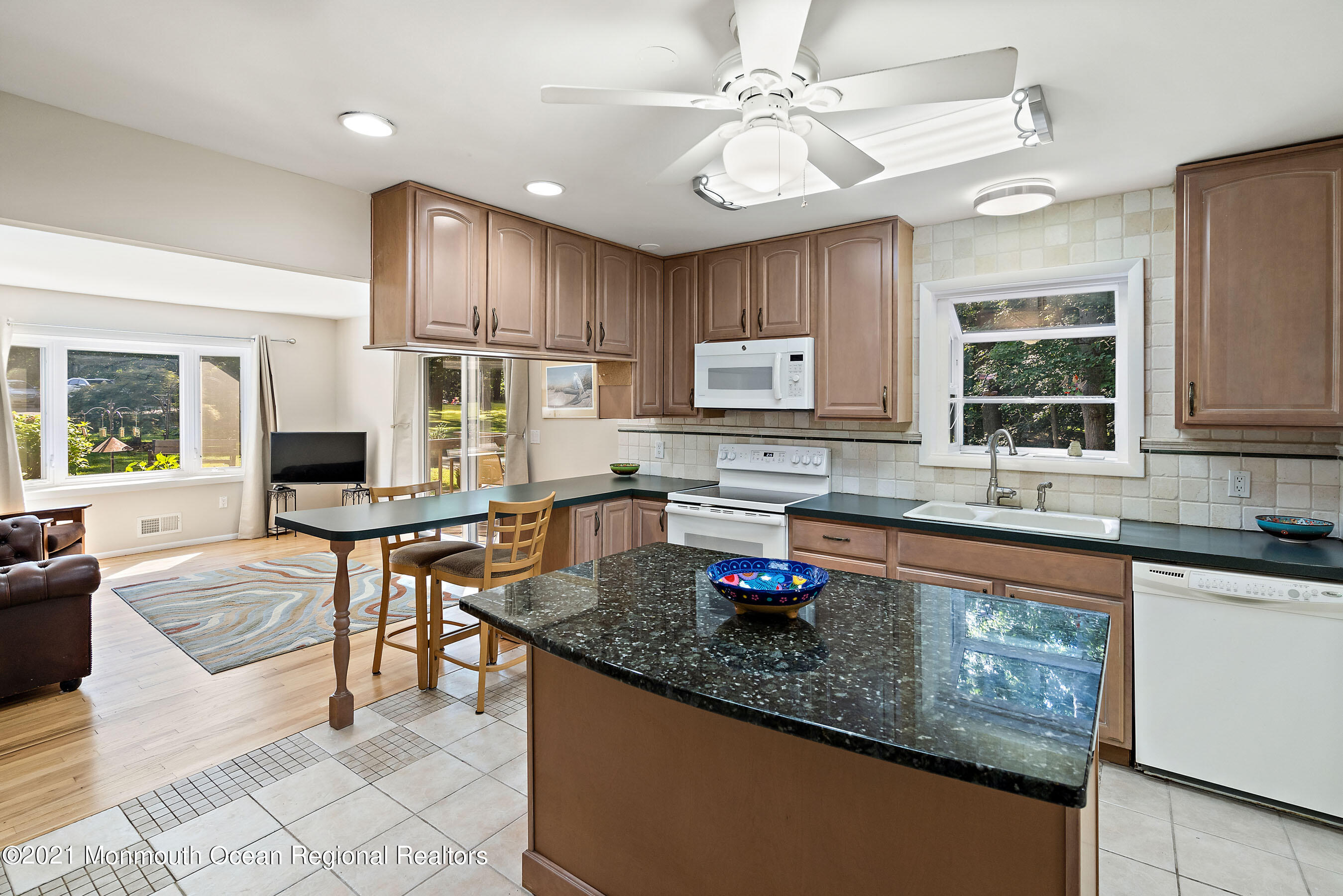 88 Beechwood Road Lincroft, NJ 07738 - Photo 9 of 33 a kitchen with stainless steel appliances granite countertop a sink stove and refrigerator