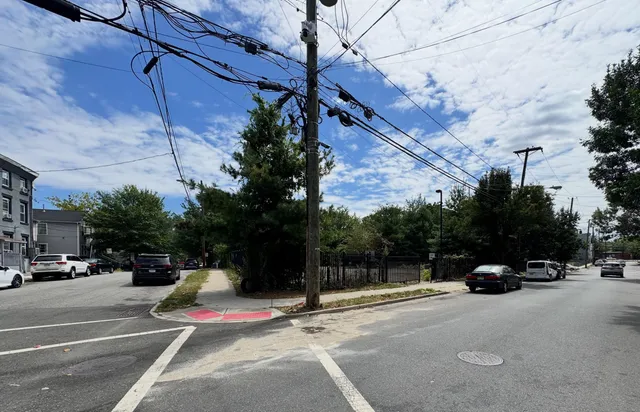 a view of street with parked cars
