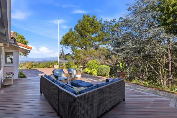 swimming pool view with a seating space