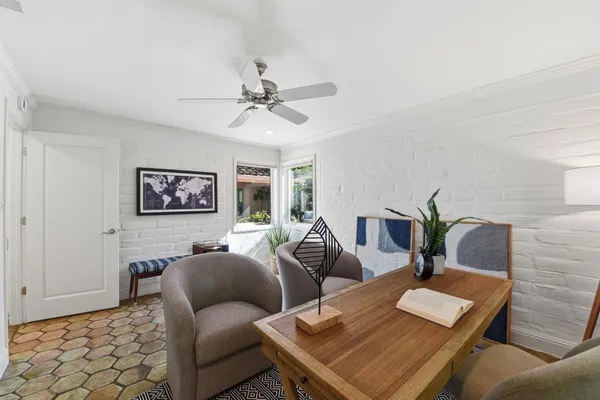 a living room with furniture and a table