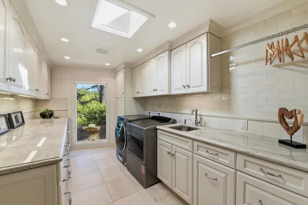 a kitchen with a sink stove and cabinets