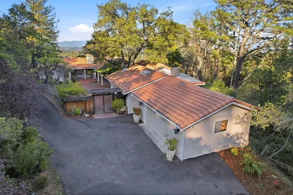 a aerial view of a house with a yard and garage