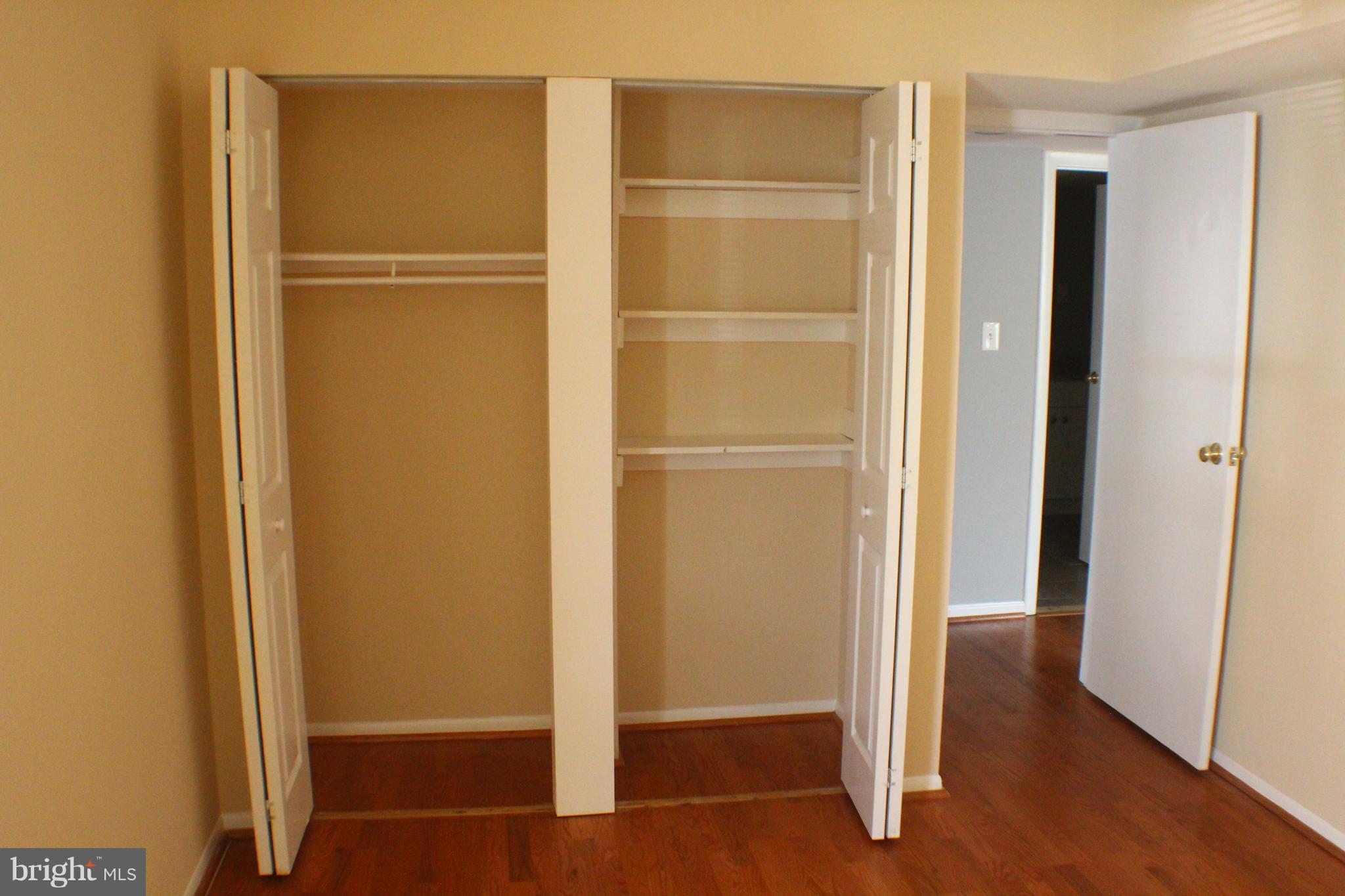 5816 Royal Ridge Drive, Unit D Springfield, VA 22152 - Photo 13 of 15 a view of walk in closet with empty racks
