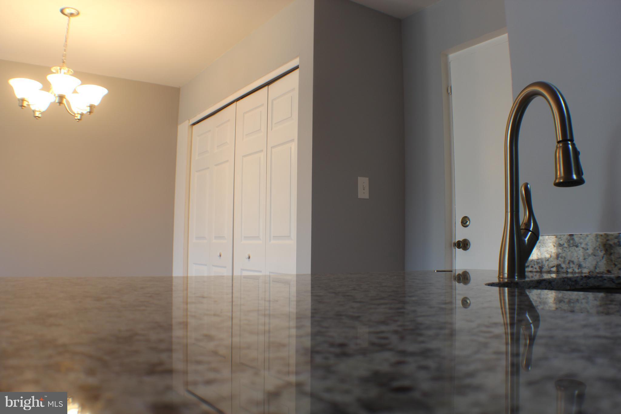 5816 Royal Ridge Drive, Unit D Springfield, VA 22152 - Photo 4 of 15 a view of empty room with window