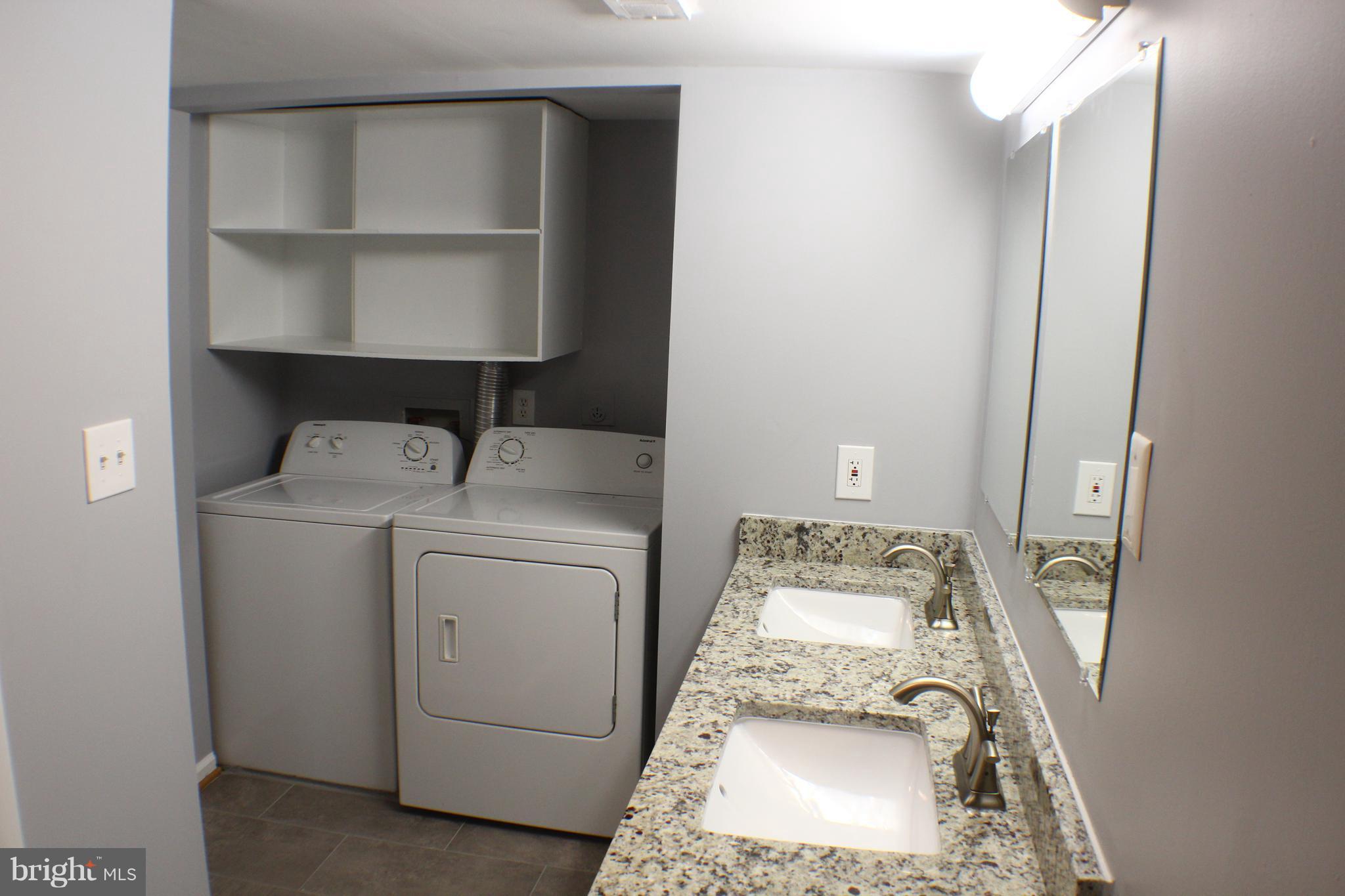 5816 Royal Ridge Drive, Unit D Springfield, VA 22152 - Photo 8 of 15 a utility room with dryer and washer