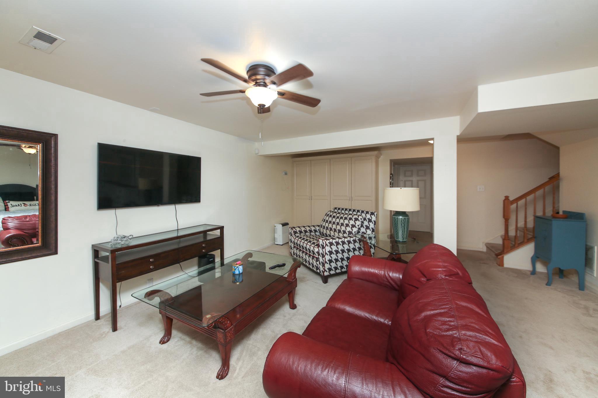 535 Mockingbird Way Warrington, PA 18976 - Photo 18 of 27 a living room with furniture and a flat screen tv