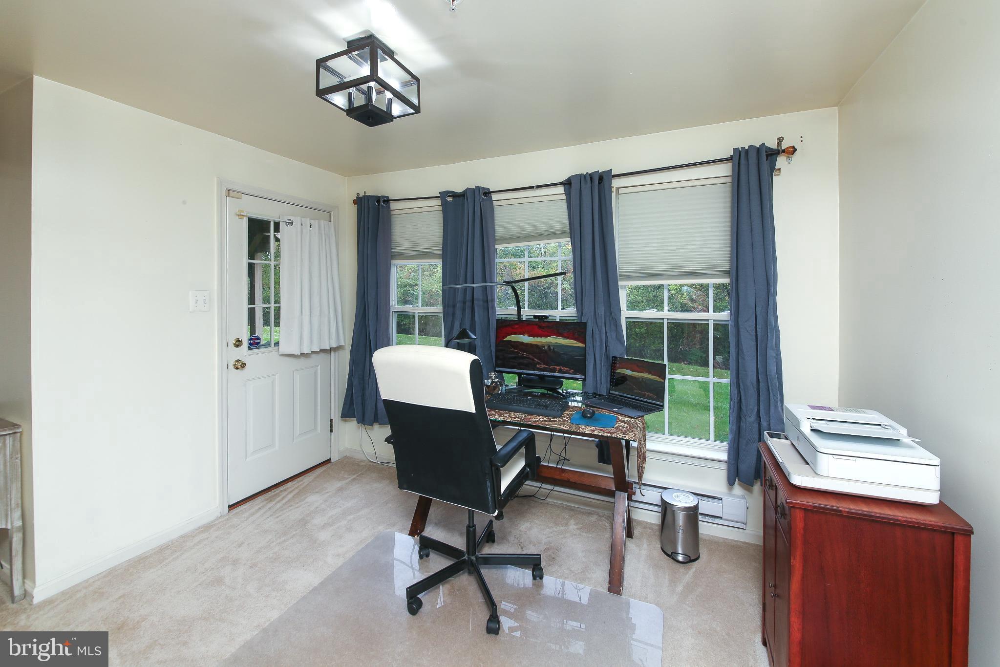 535 Mockingbird Way Warrington, PA 18976 - Photo 19 of 27 a view of a workspace with furniture and a window
