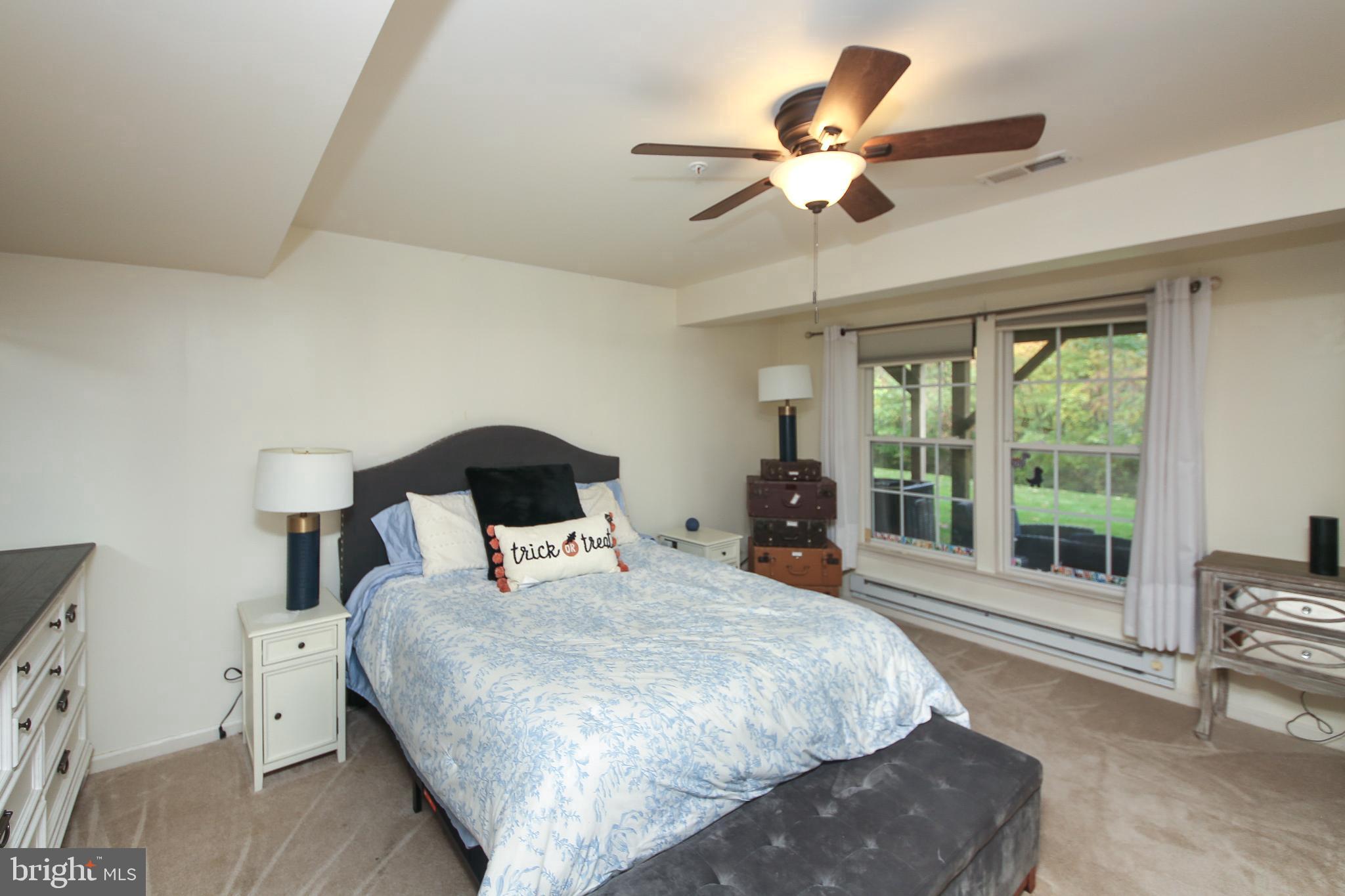 535 Mockingbird Way Warrington, PA 18976 - Photo 20 of 27 a bedroom with a large bed and a large window