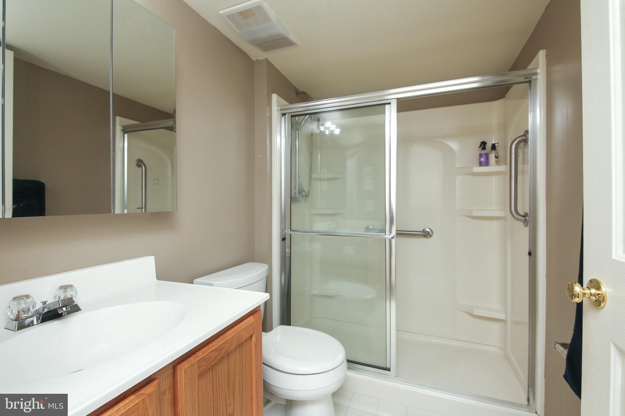 535 Mockingbird Way Warrington, PA 18976 - Photo 21 of 27 a bathroom with a granite countertop sink toilet and shower