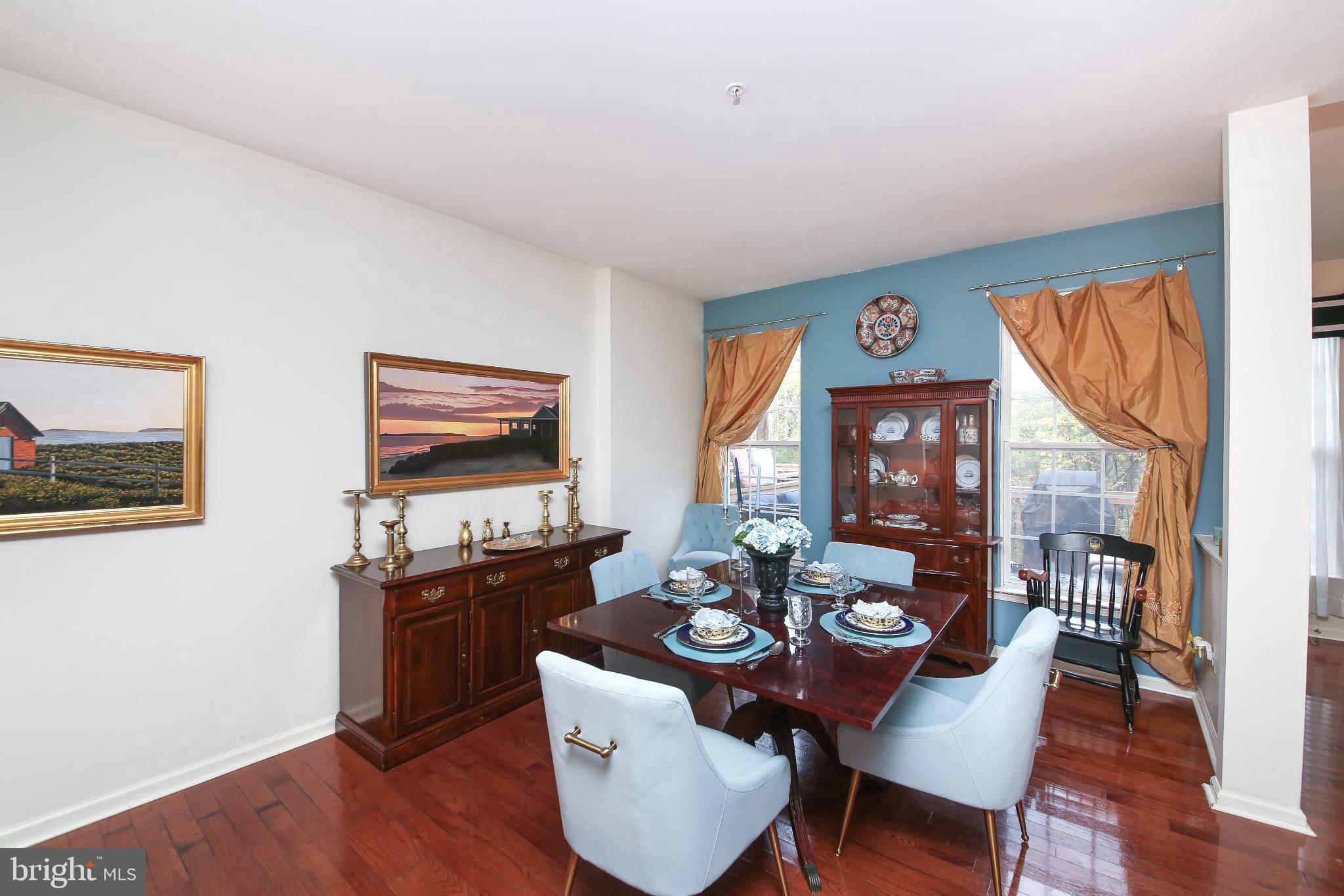 535 Mockingbird Way Warrington, PA 18976 - Photo 4 of 27 a view of a dining room with furniture and wooden floor