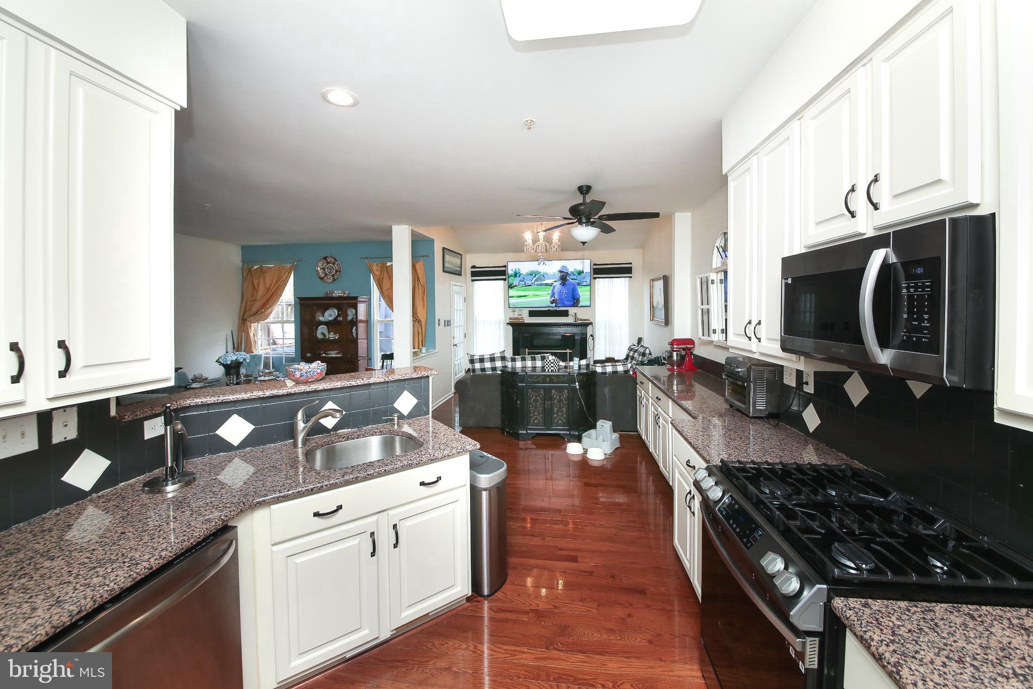 535 Mockingbird Way Warrington, PA 18976 - Photo 6 of 27 a kitchen with stainless steel appliances granite countertop a stove and a sink