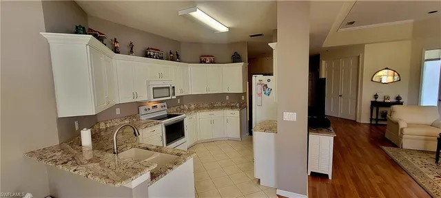 a view of a dining room with furniture and window