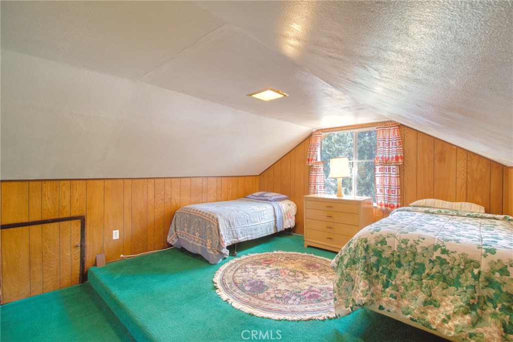 1215 Lark Road Wrightwood, CA 92397 - Photo 18 of 34 a bed room with a bed and a window
