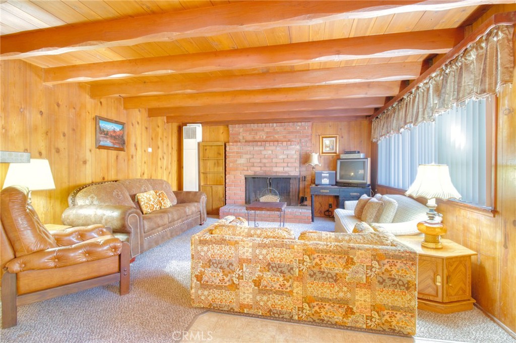 1215 Lark Road Wrightwood, CA 92397 - Photo 4 of 34 a view of a living room with a couch