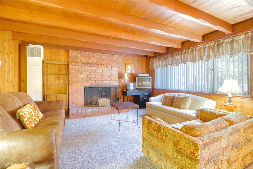 1215 Lark Road Wrightwood, CA 92397 - Photo 5 of 34 a living room with furniture and a large window