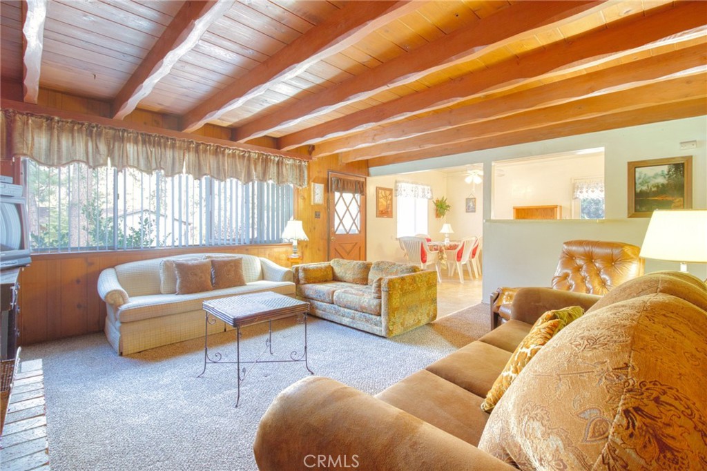 1215 Lark Road Wrightwood, CA 92397 - Photo 6 of 34 a living room with furniture and a large window