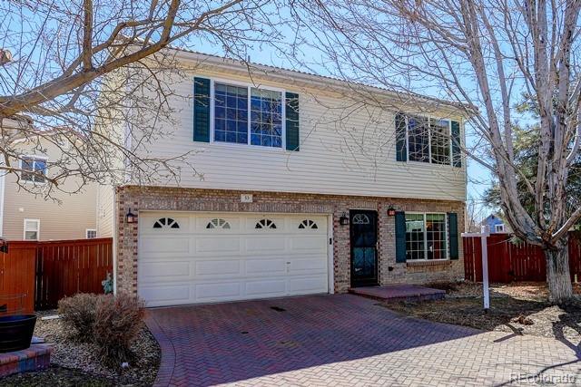20000 Mitchell Place, Unit 53 Denver, CO 80249 - Photo 1 of 40 a backyard of a house with plants and trees