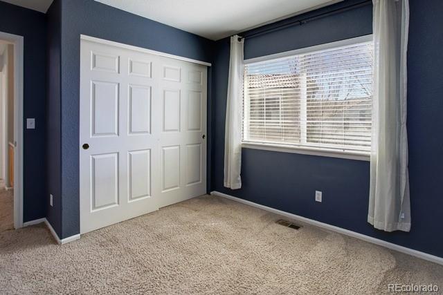 20000 Mitchell Place, Unit 53 Denver, CO 80249 - Photo 25 of 40 a view of an empty room with a window