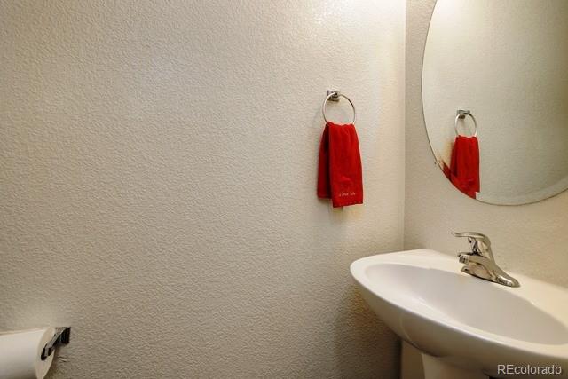 20000 Mitchell Place, Unit 53 Denver, CO 80249 - Photo 28 of 40 a bathroom with a sink and a mirror