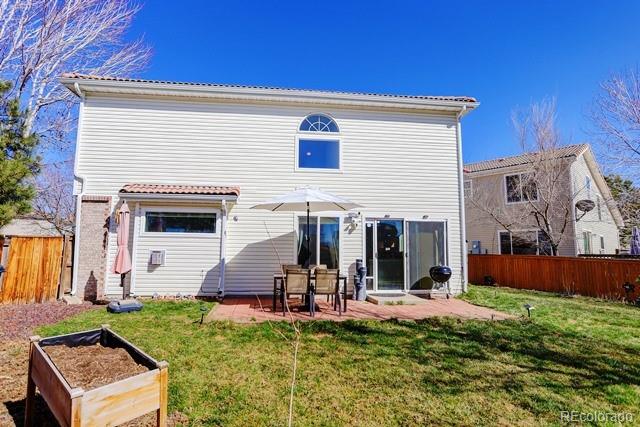 20000 Mitchell Place, Unit 53 Denver, CO 80249 - Photo 31 of 40 a view of a house with backyard and sitting area