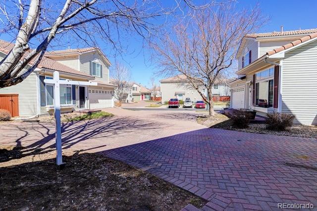 20000 Mitchell Place, Unit 53 Denver, CO 80249 - Photo 36 of 40 a street view with a building in the background