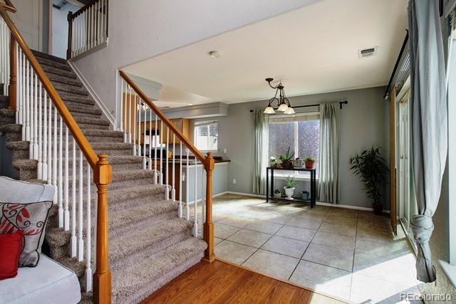 20000 Mitchell Place, Unit 53 Denver, CO 80249 - Photo 7 of 40 a view of an entryway door and hallway