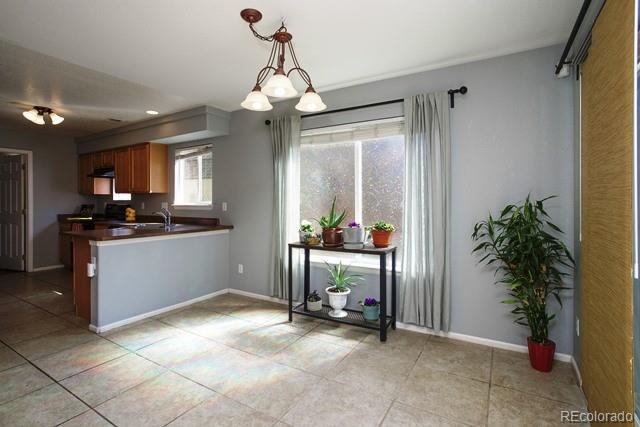 20000 Mitchell Place, Unit 53 Denver, CO 80249 - Photo 9 of 40 a kitchen with counter top space and appliances