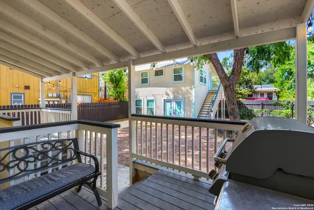 a view of balcony with wooden floor