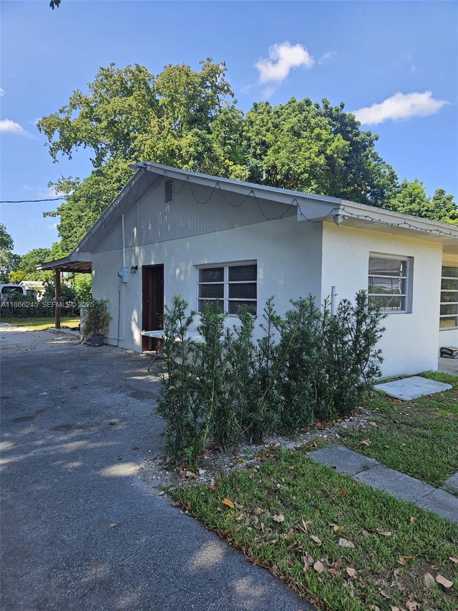 19230 Southwest 216th Street Miami, FL 33170 - Photo 13 of 55 front view of a house with a yard