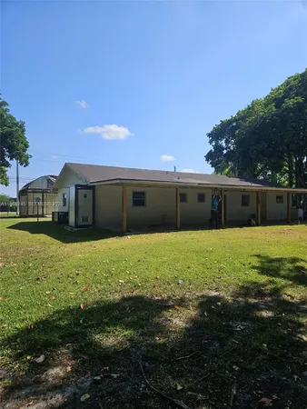 a view of a bedroom with a bed and a view of bathroom