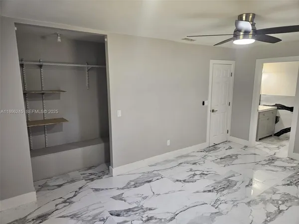 a kitchen with granite countertop a stove and a sink
