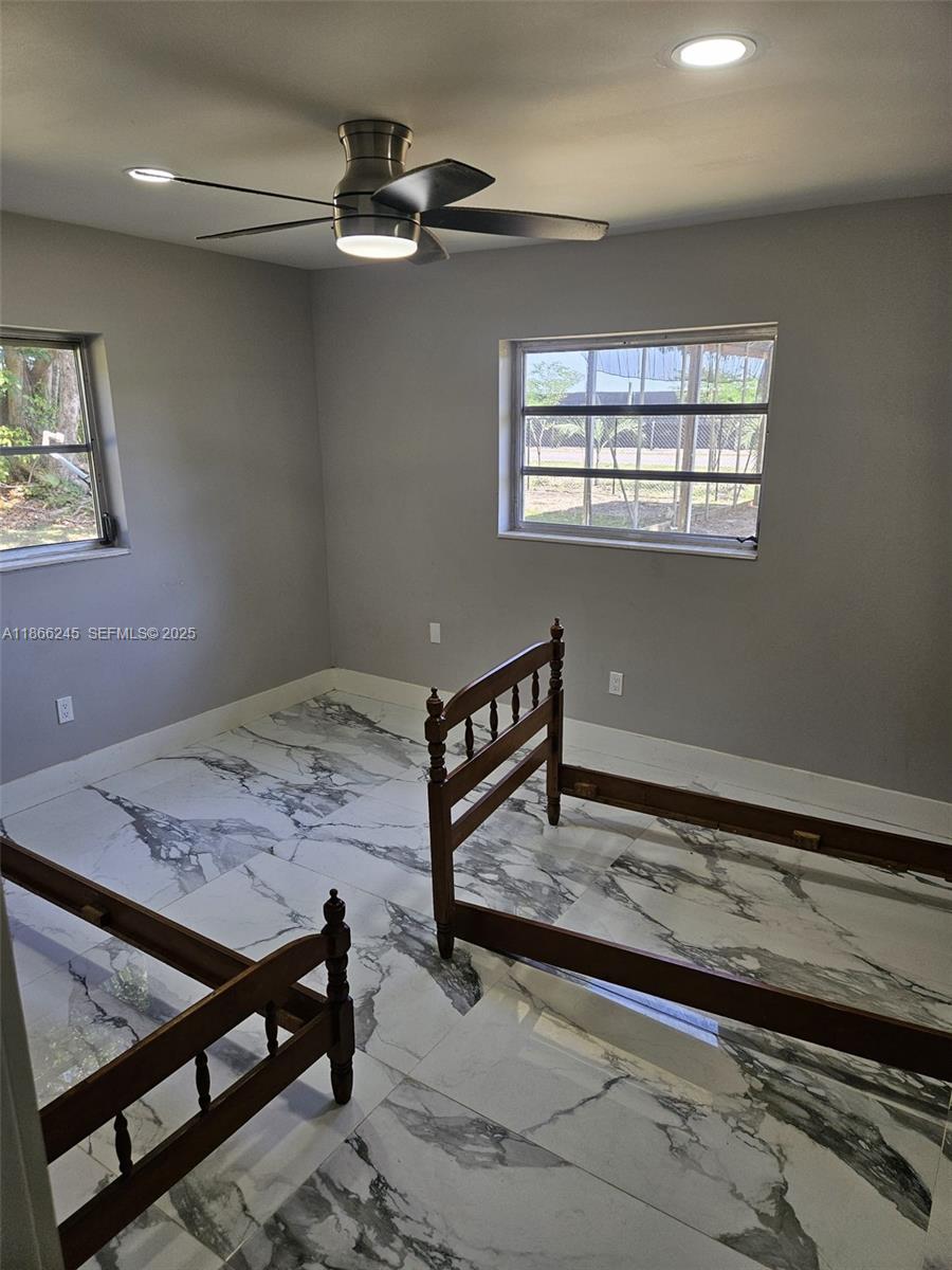19230 Southwest 216th Street Miami, FL 33170 - Photo 23 of 55 a view of a hallway with a window