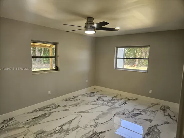 a bedroom with a bed and a stove