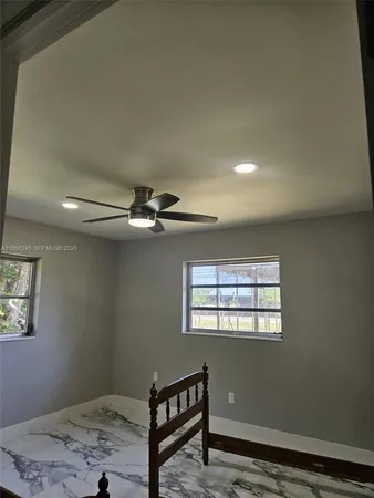 a view of a bed in a bedroom