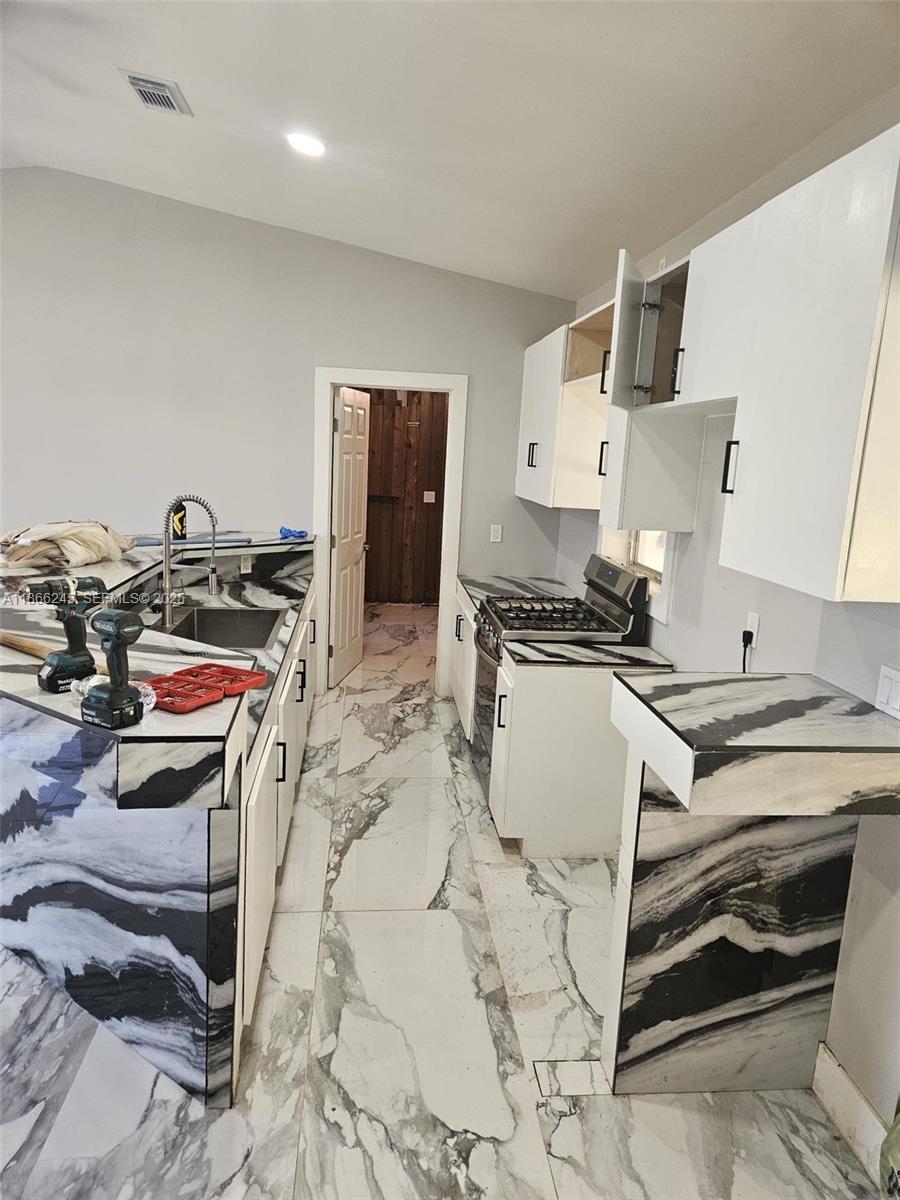 19230 Southwest 216th Street Miami, FL 33170 - Photo 31 of 55 a bedroom with a bed and a stove