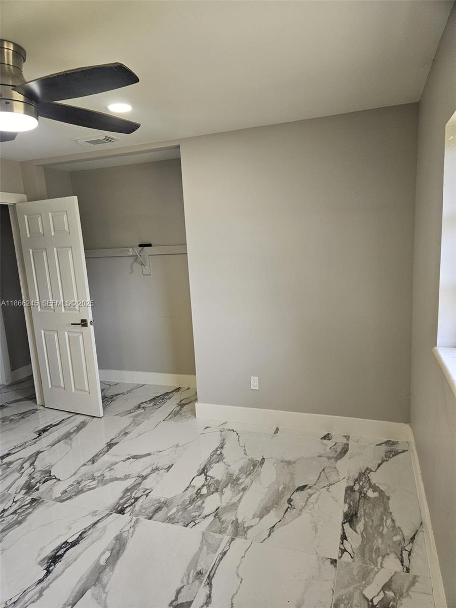 19230 Southwest 216th Street Miami, FL 33170 - Photo 32 of 55 a view of a bed in a bedroom