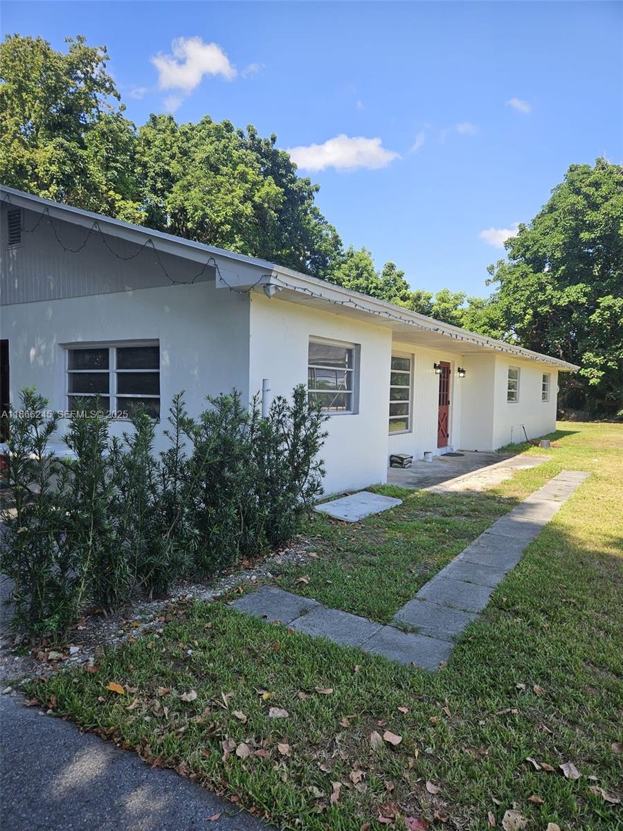 19230 Southwest 216th Street Miami, FL 33170 - Photo 34 of 55 a view of a house with a yard
