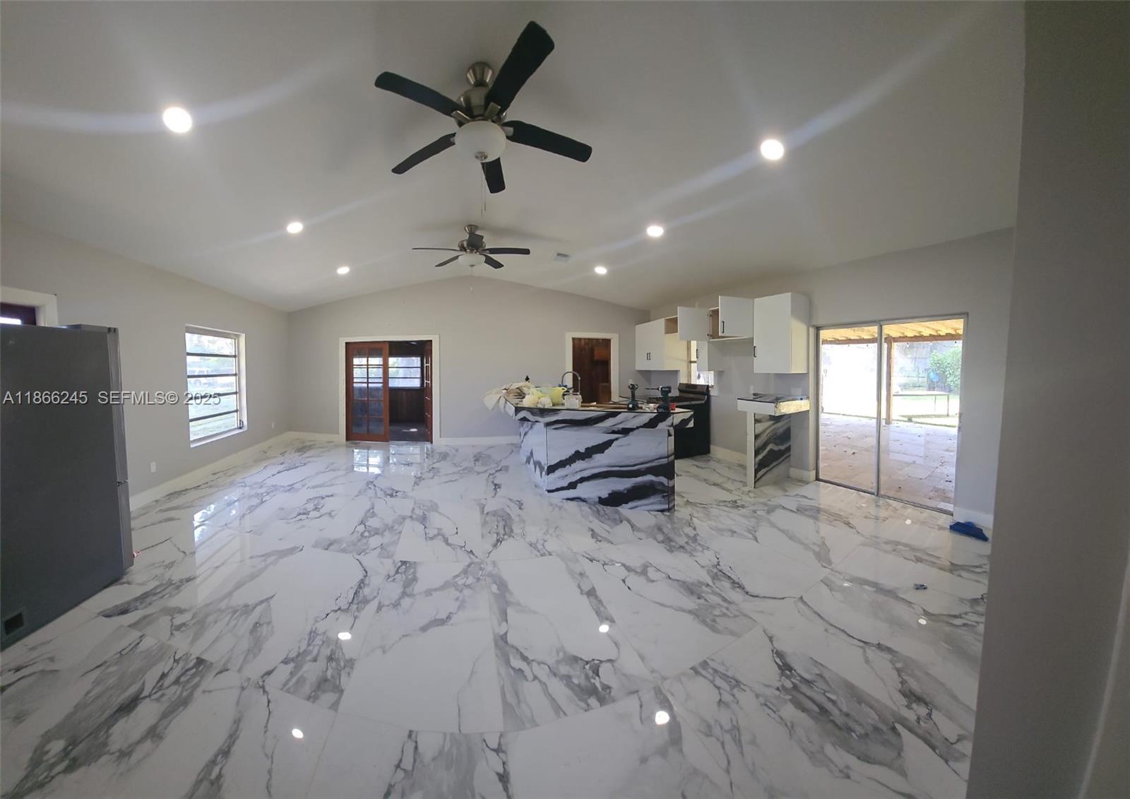 19230 Southwest 216th Street Miami, FL 33170 - Photo 35 of 55 a living room with furniture and kitchen view
