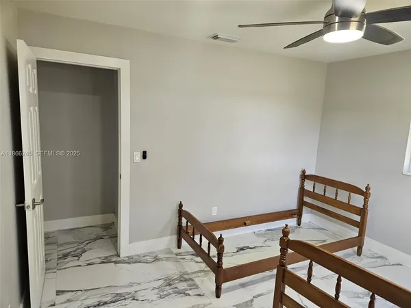 a view of a room with closet and window