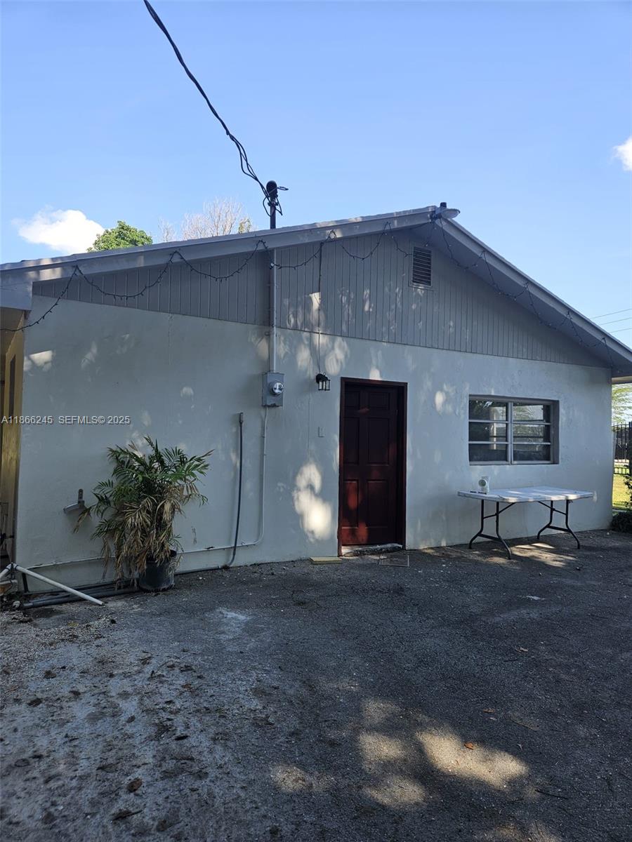 19230 Southwest 216th Street Miami, FL 33170 - Photo 51 of 55 a front view of a house with garden