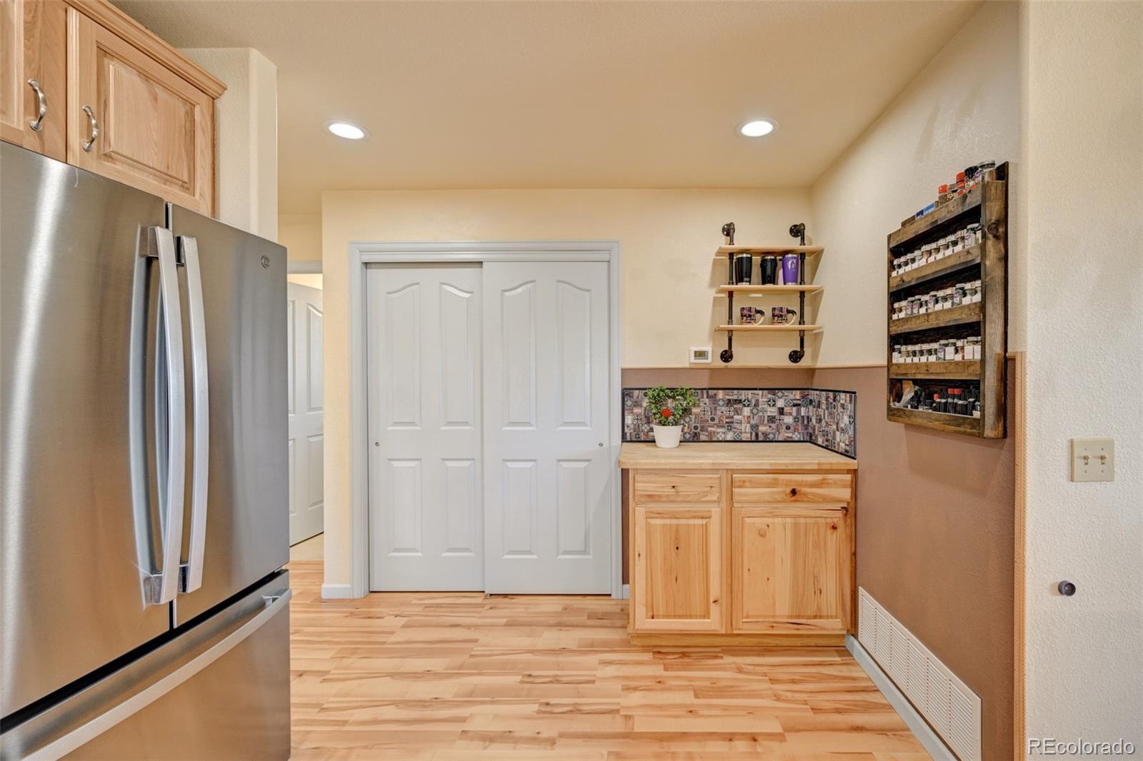 9473 Ranch Road Hartsel, CO 80449 - Photo 11 of 50 a kitchen with stainless steel appliances a refrigerator and a stove top oven