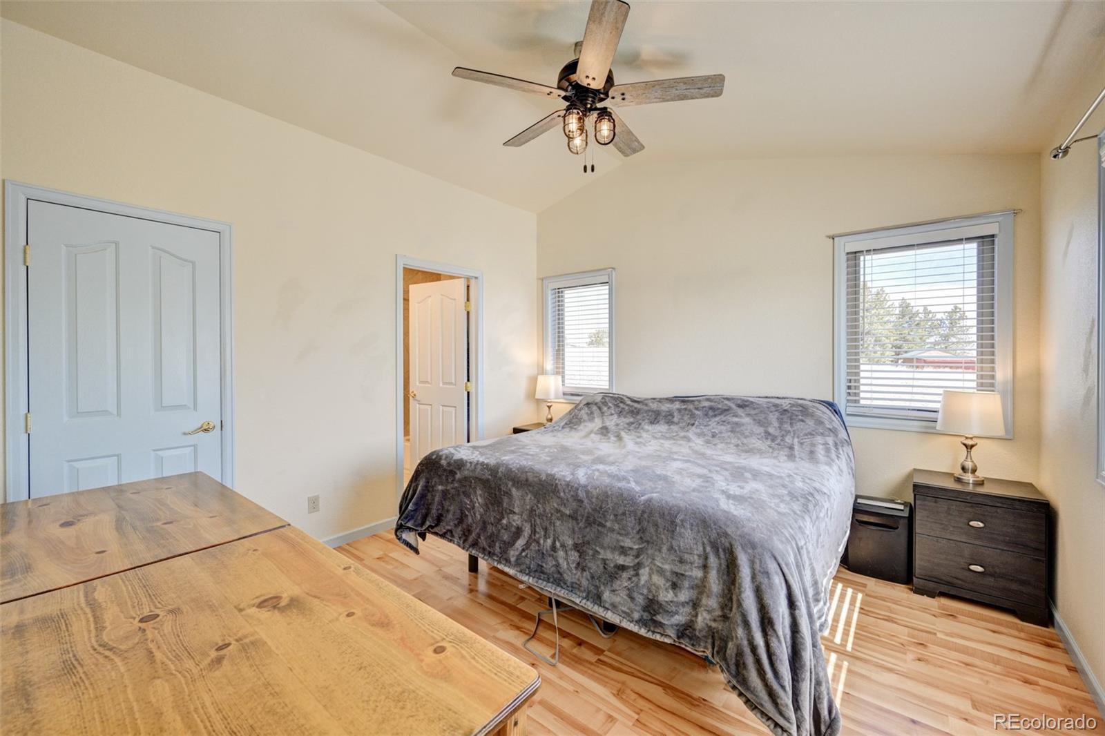 9473 Ranch Road Hartsel, CO 80449 - Photo 13 of 50 a bedroom with a bed and wooden floor
