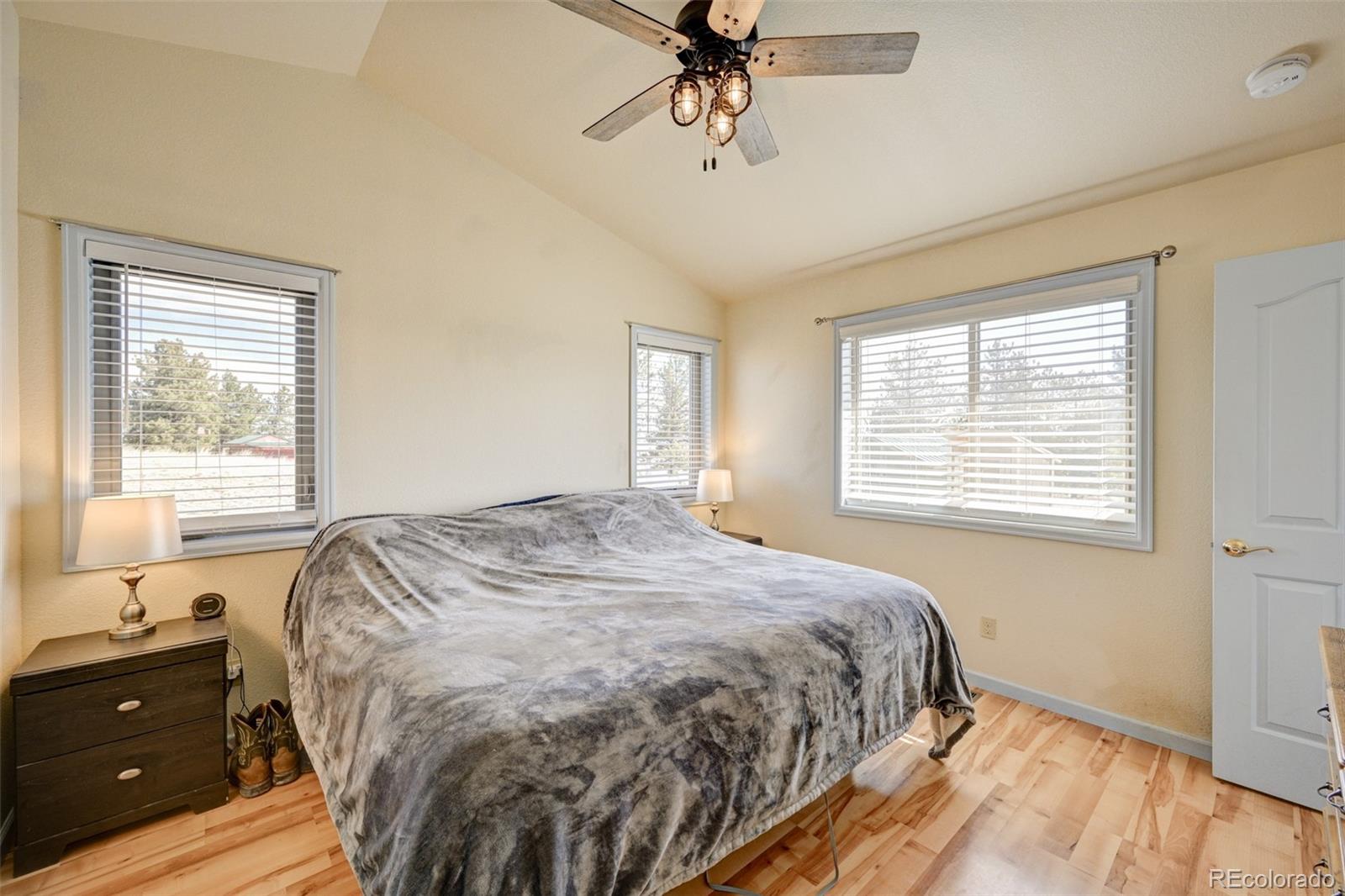 9473 Ranch Road Hartsel, CO 80449 - Photo 15 of 50 a bedroom with a bed and window